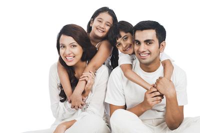 family of four smiling