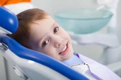 Boy relaxing during dental check up in Aurora, IL