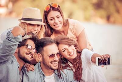 A group smiling after dental bridge in Aurora IL