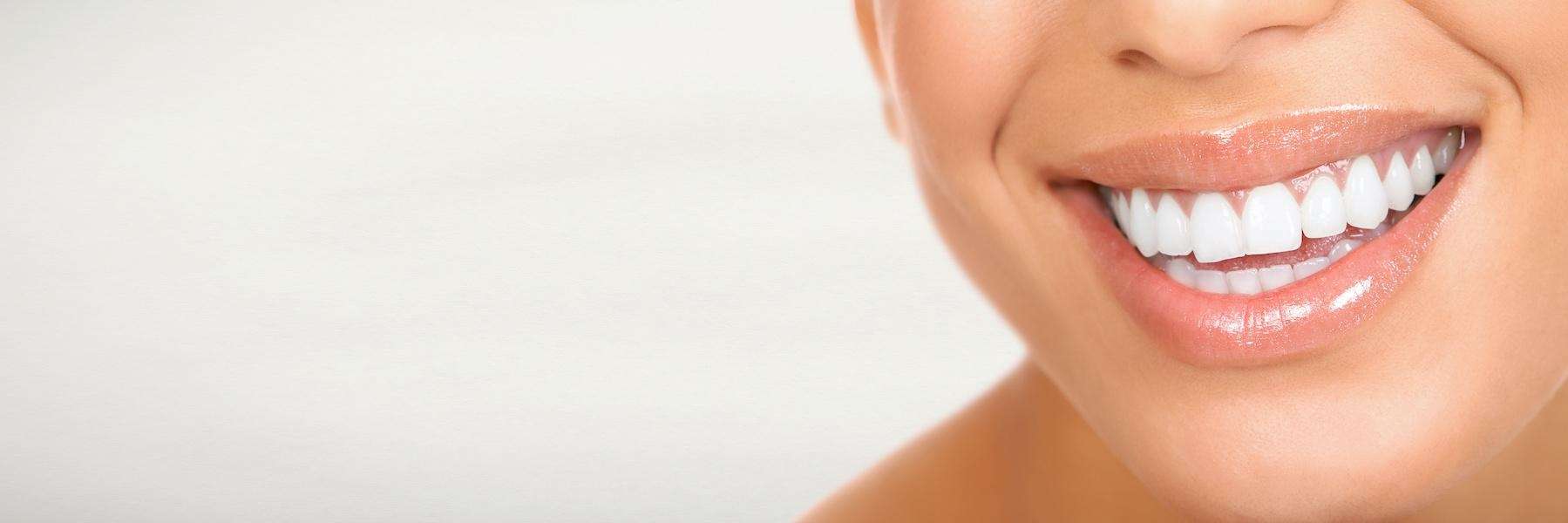 Lady smiling after getting dental crowns in Aurora, IL