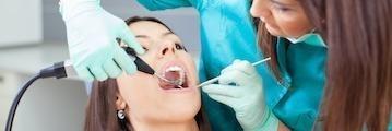 Woman undergoing dental examination in Aurora, IL