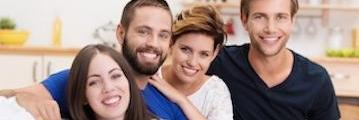 A family smiling after teeth whitening in Aurora, IL