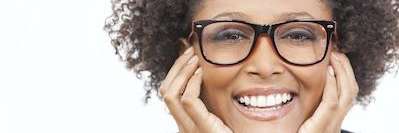 A woman smiling after getting dental dentures in Aurora, IL