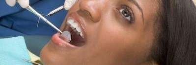 Lady undergoing tooth extraction in Aurora, IL