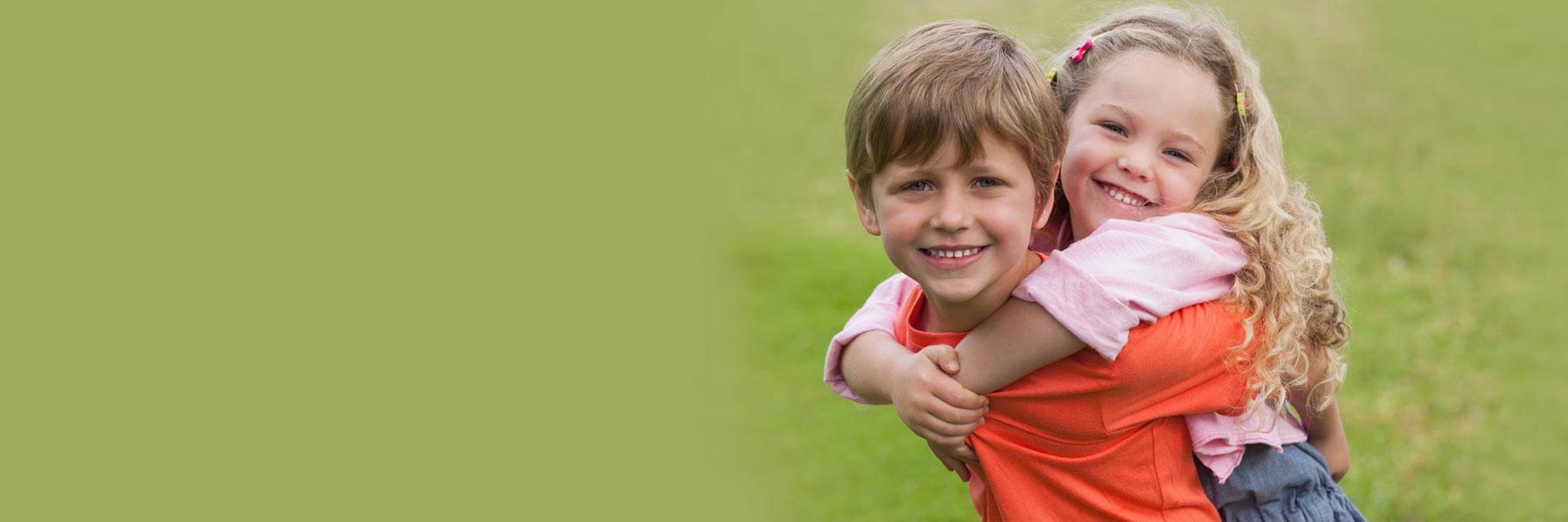 A young boy and young girl smiling | Dentist Aurora IL